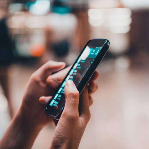 Person searching for a local business on a smartphone